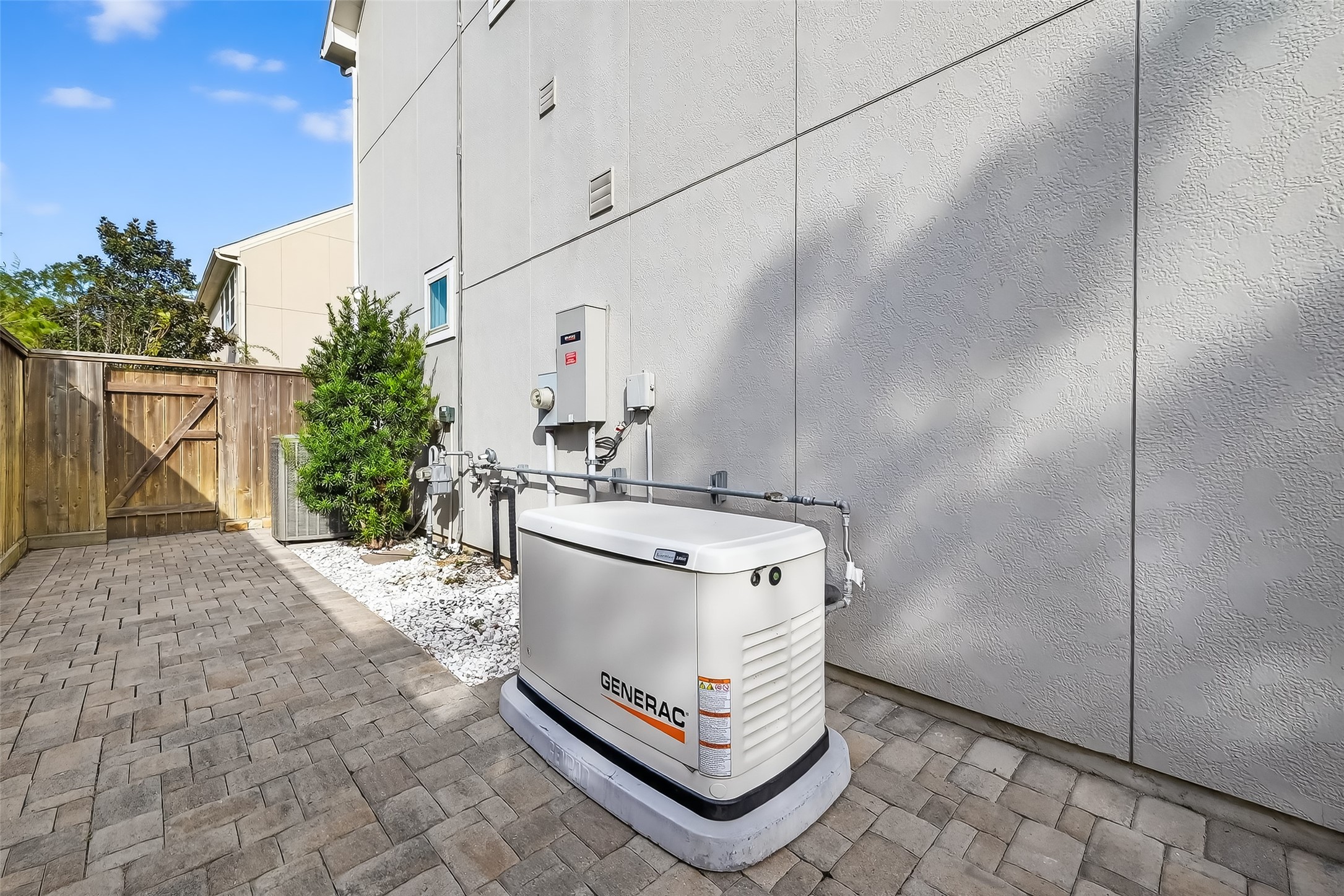 10514 Concha Lane Houston, TX 77096 - Photo 34 of 50 View of side of house with Generac whole house Generator installed in 2024. Also, conduit installed to be used if solar panels were installed in the future.