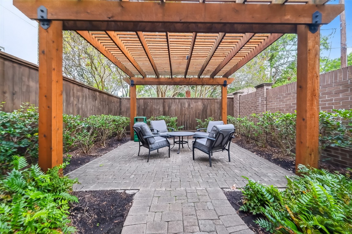 10514 Concha Lane Houston, TX 77096 - Photo 40 of 50 Lovely arbor structure for the residence of the Enclave at Willow Park community.