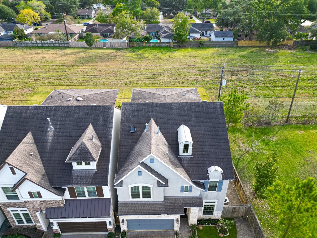 10514 Concha Lane Houston, TX 77096 - Photo 43 of 50 Aerial view of home with lots of greenspace on the side and behind the property. Tech shield in attic. Tankless Hot Water Heater.