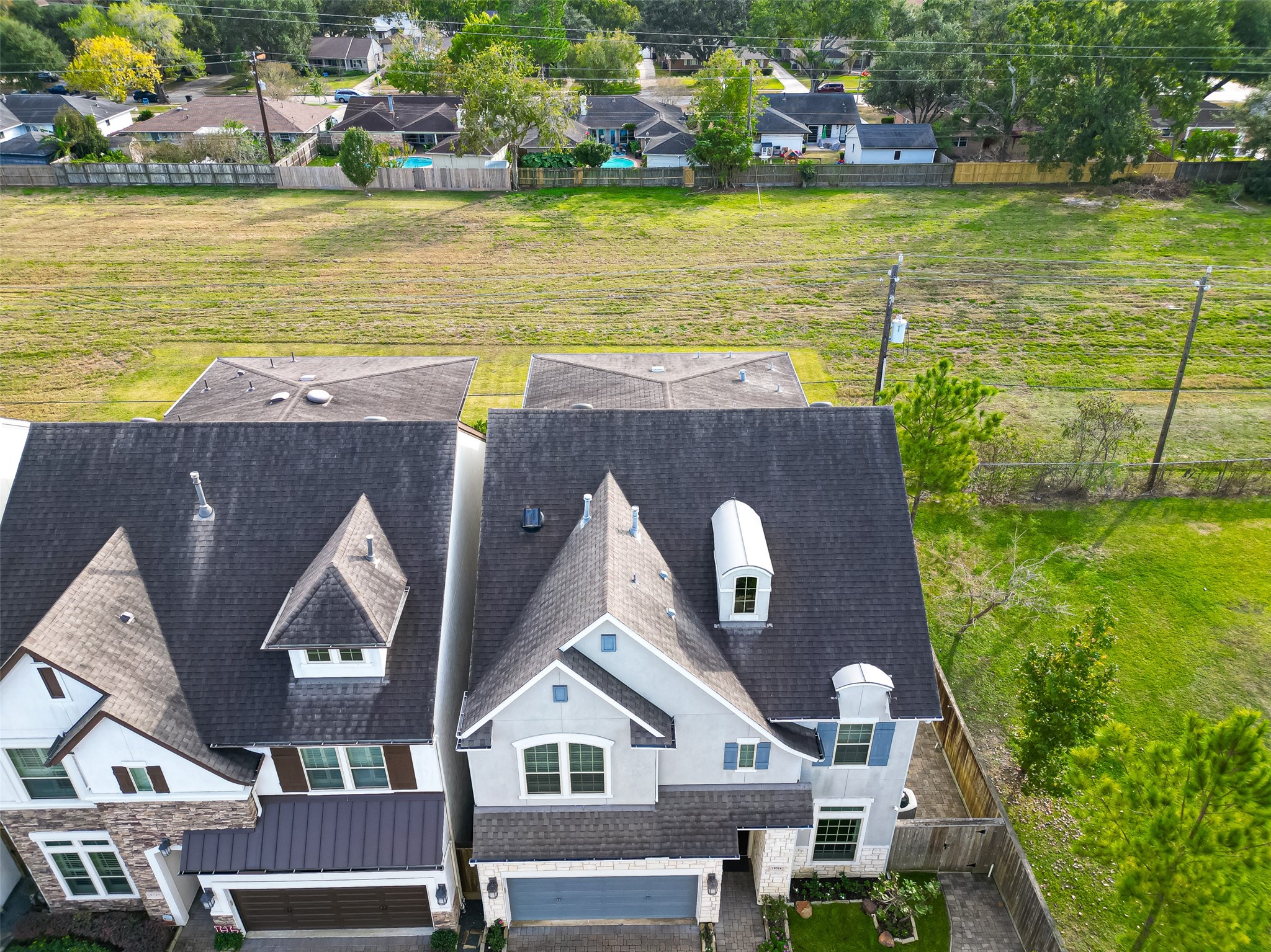 10514 Concha Lane Houston, TX 77096 - Photo 43 of 50 Aerial view of home with lots of greenspace on the side and behind the property. Tech shield in attic. Tankless Hot Water Heater.