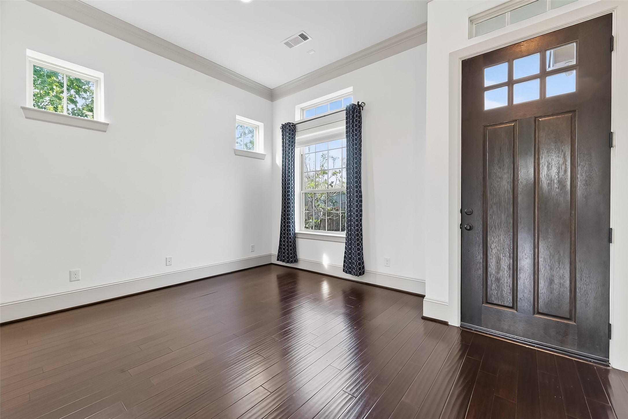 10514 Concha Lane Houston, TX 77096 - Photo 6 of 50 Study located next to front entry. View of lovely rich wood front door in dark stain to compliment the wood floors.