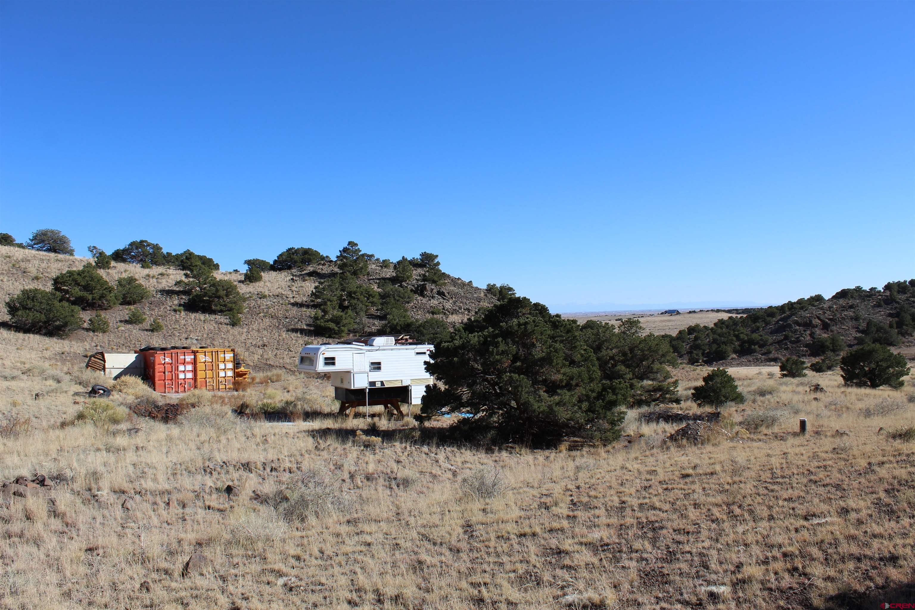 7 Ghost Mine Ranch Del Norte, CO 81132 - Photo 13 of 35 a view of a dry yard with trees