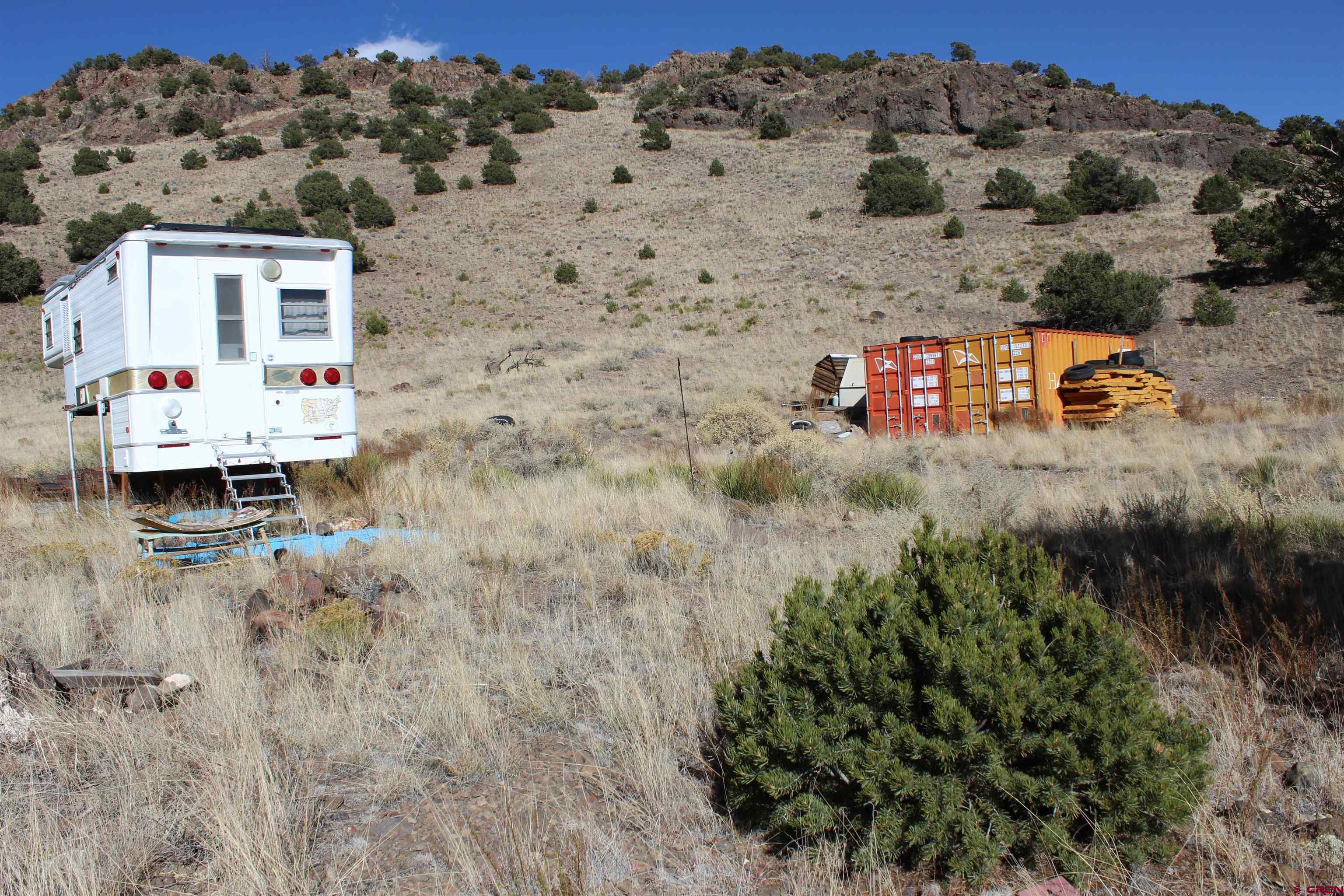 7 Ghost Mine Ranch Del Norte, CO 81132 - Photo 17 of 35 a aerial view of a house with a yard