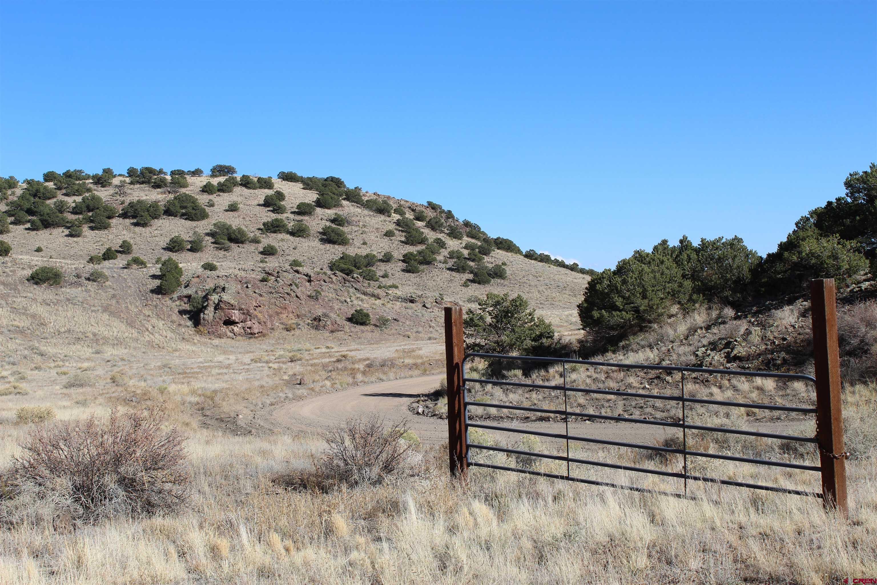 7 Ghost Mine Ranch Del Norte, CO 81132 - Photo 30 of 35 a view of a dry yard with wooden fence