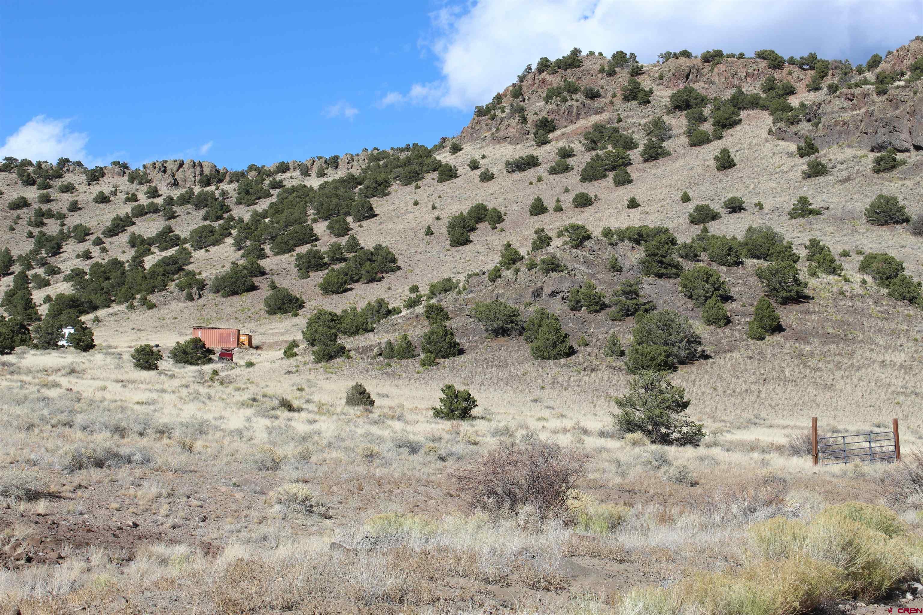 7 Ghost Mine Ranch Del Norte, CO 81132 - Photo 7 of 35 a view of a dry field covered with snow