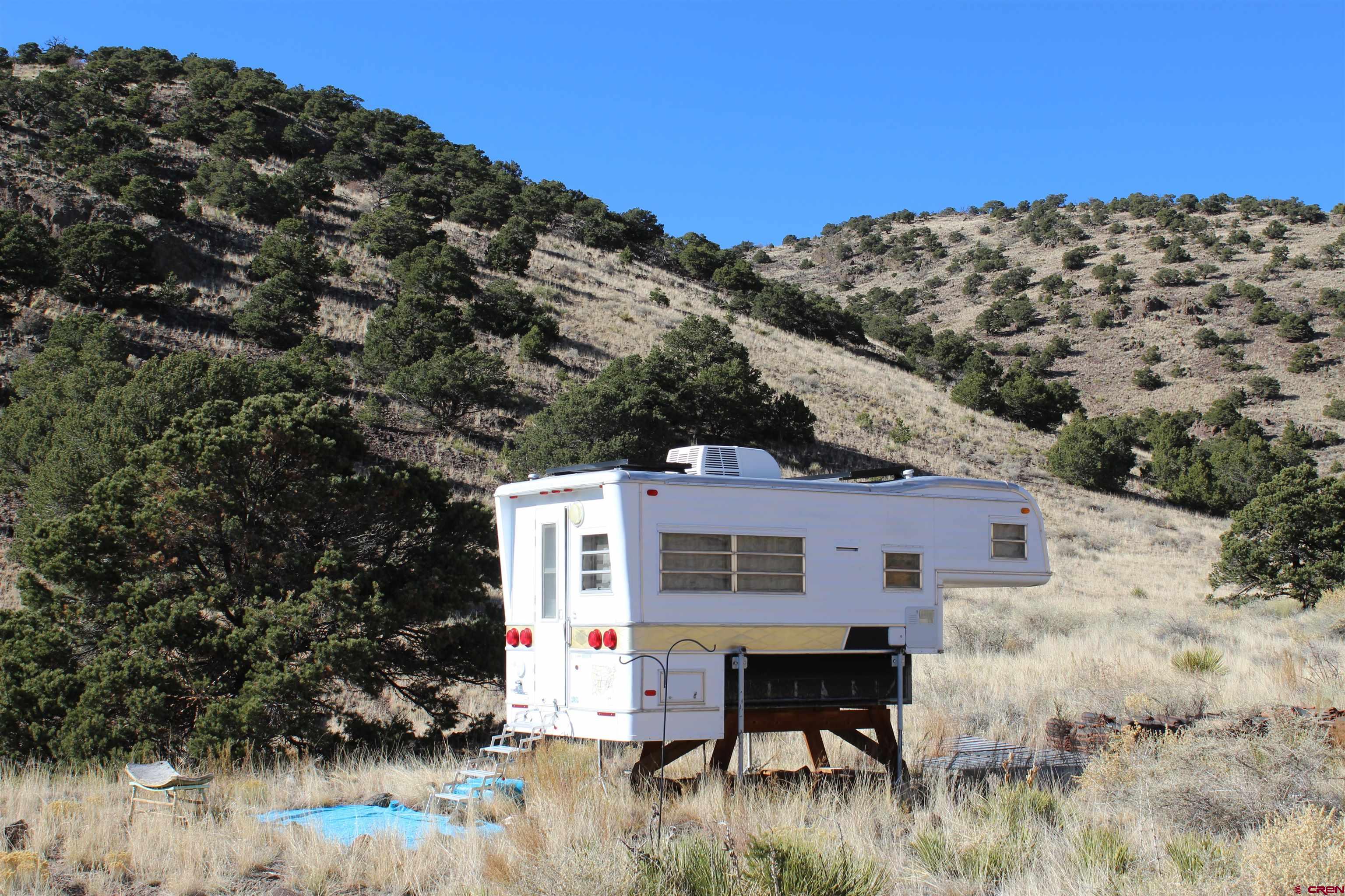 7 Ghost Mine Ranch Del Norte, CO 81132 - Photo 10 of 35 a view of a house with a yard