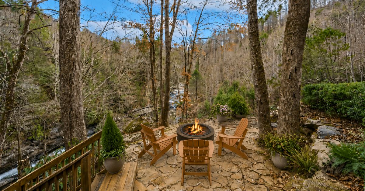 102 State Rd S-39-143 Sunset, SC 29685 - Photo 7 of 47 This secluded outdoor retreat features a fire pit, perfect for enjoying the serene forest and river views.