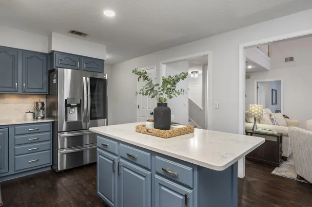 a stove top oven sitting inside of a kitchen