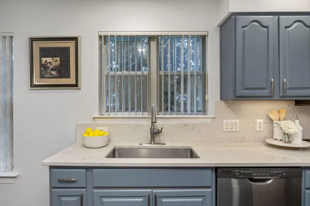 a bedroom with a bed and a television