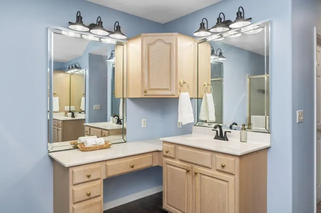 a work room with furniture and wooden floor