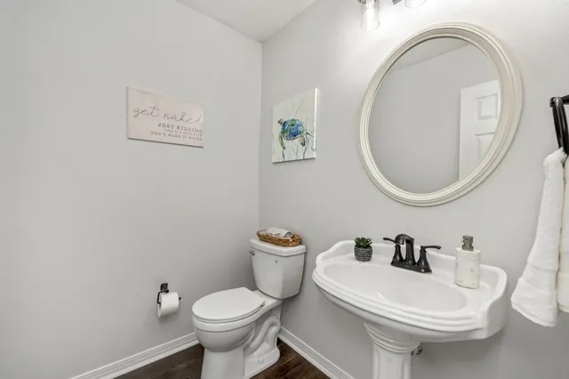 a view of hallway with wooden floor