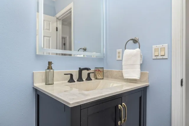 a view of a chairs and table on the wooden deck