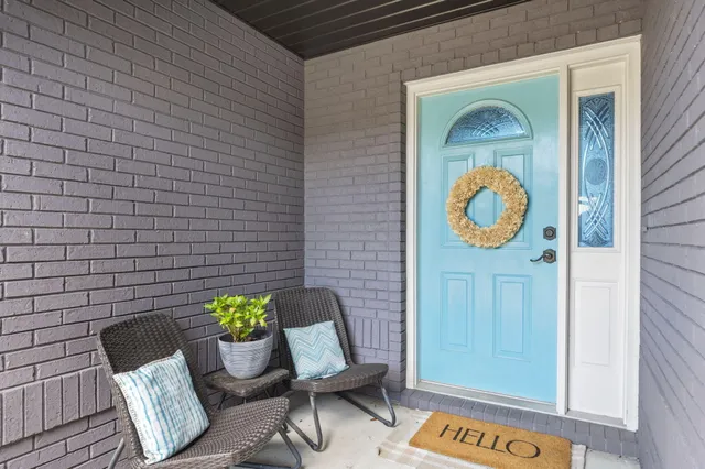 a front view of a house with outdoor space and seating