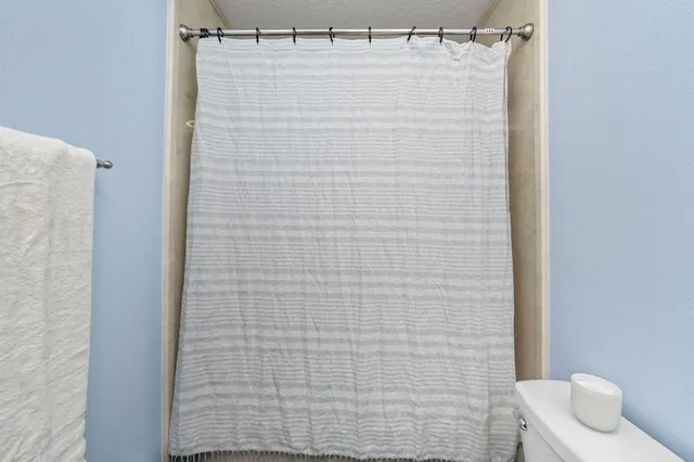 a view of a swimming pool with a lounge chair