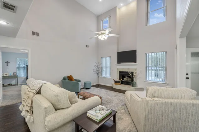 a living room with furniture and kitchen view