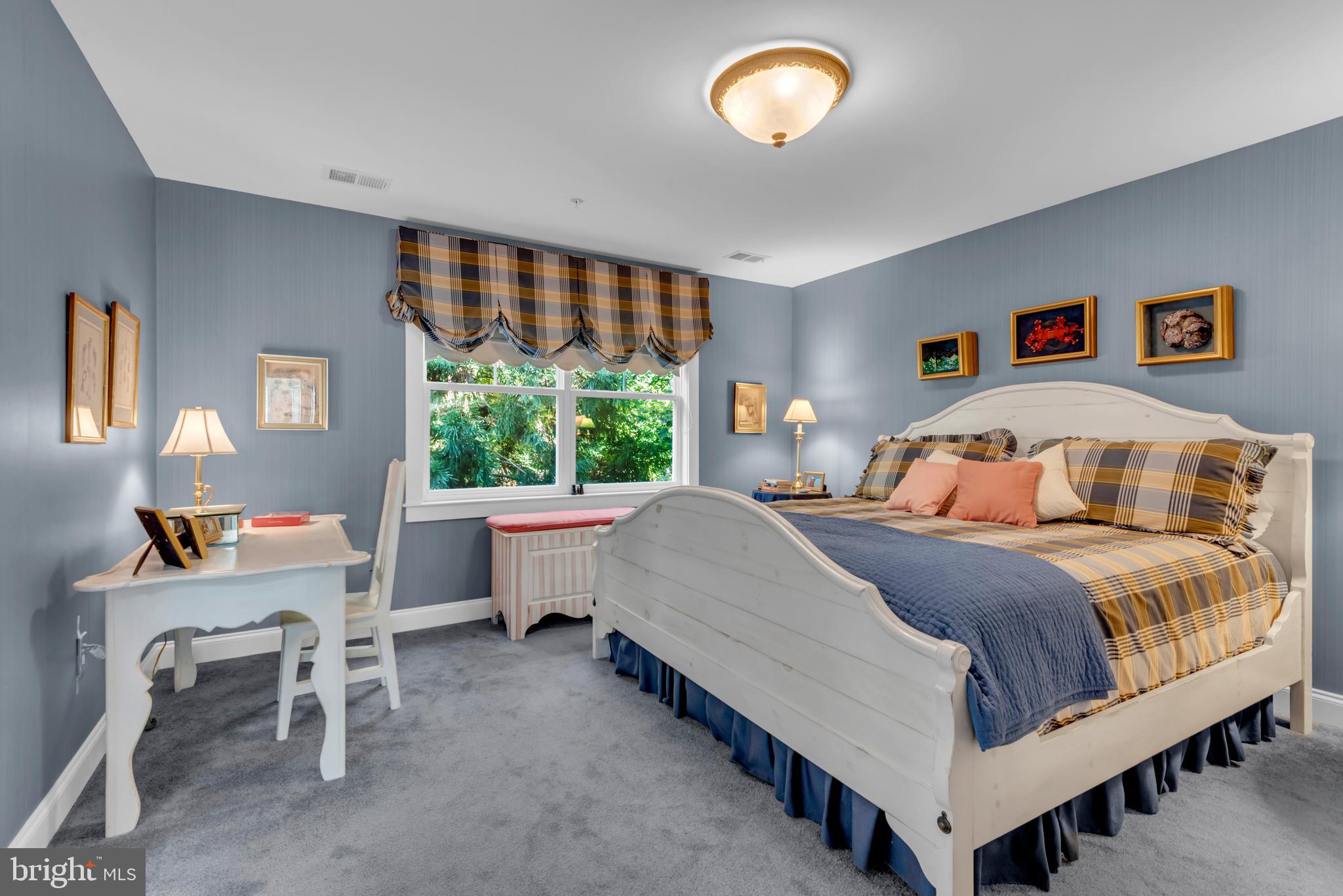 10 Sailors Way Annapolis, MD 21403 - Photo 15 of 36 a bedroom with a bed and a large window