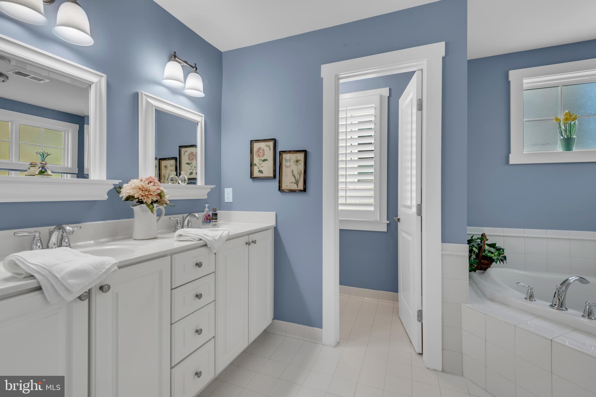10 Sailors Way Annapolis, MD 21403 - Photo 18 of 36 a bathroom with a sink double vanity and a mirror