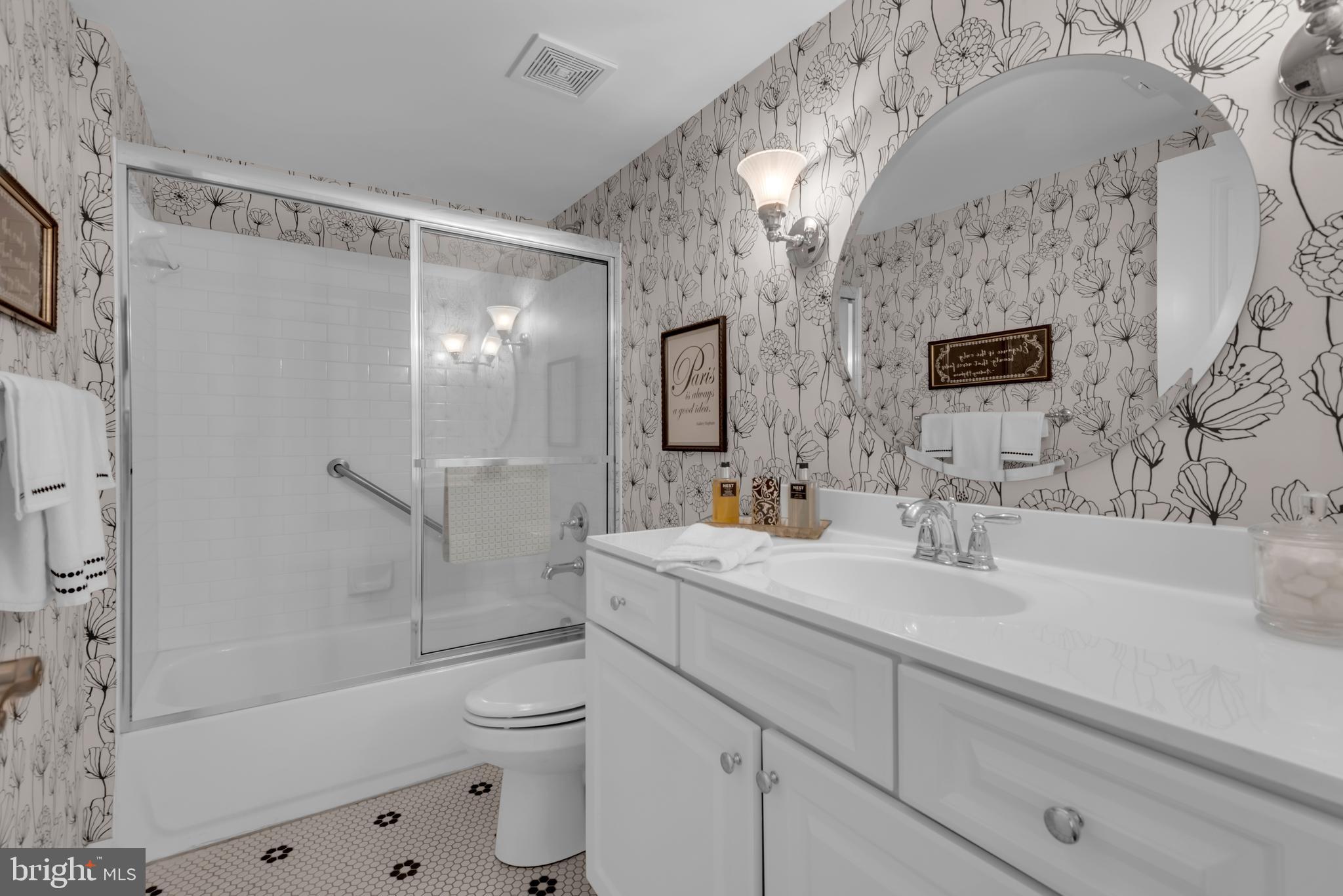 10 Sailors Way Annapolis, MD 21403 - Photo 25 of 36 a bathroom with a sink a toilet and shower