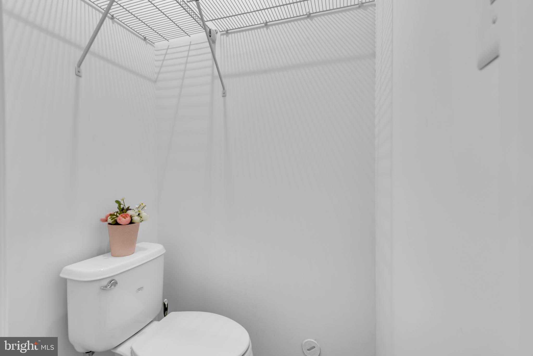 10 Sailors Way Annapolis, MD 21403 - Photo 33 of 36 a white toilet sitting next to a white shower curtain