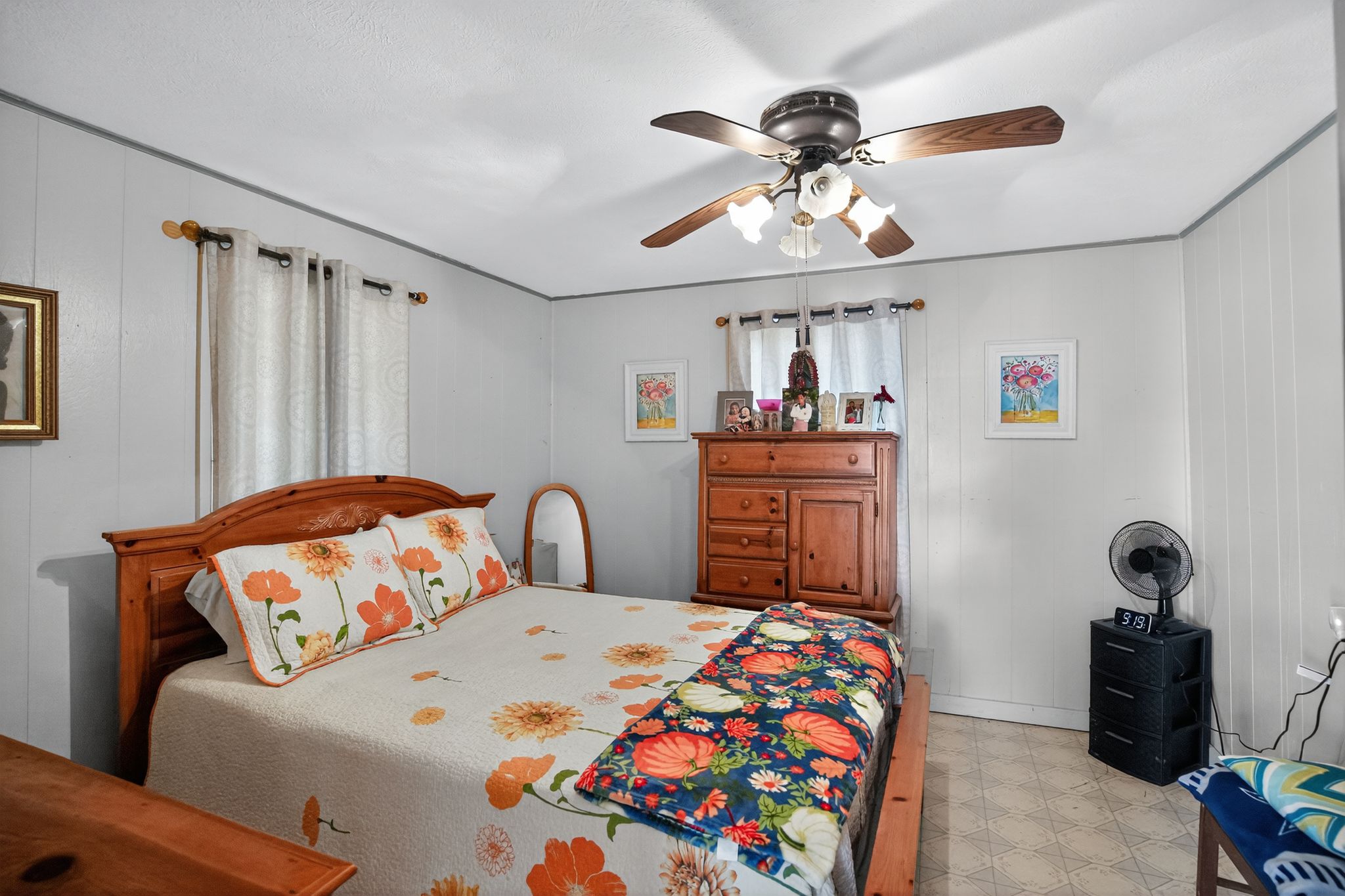 1309 Blackjack Street Lockhart, TX 78644 - Photo 14 of 15 a bedroom with a bed and wooden floor