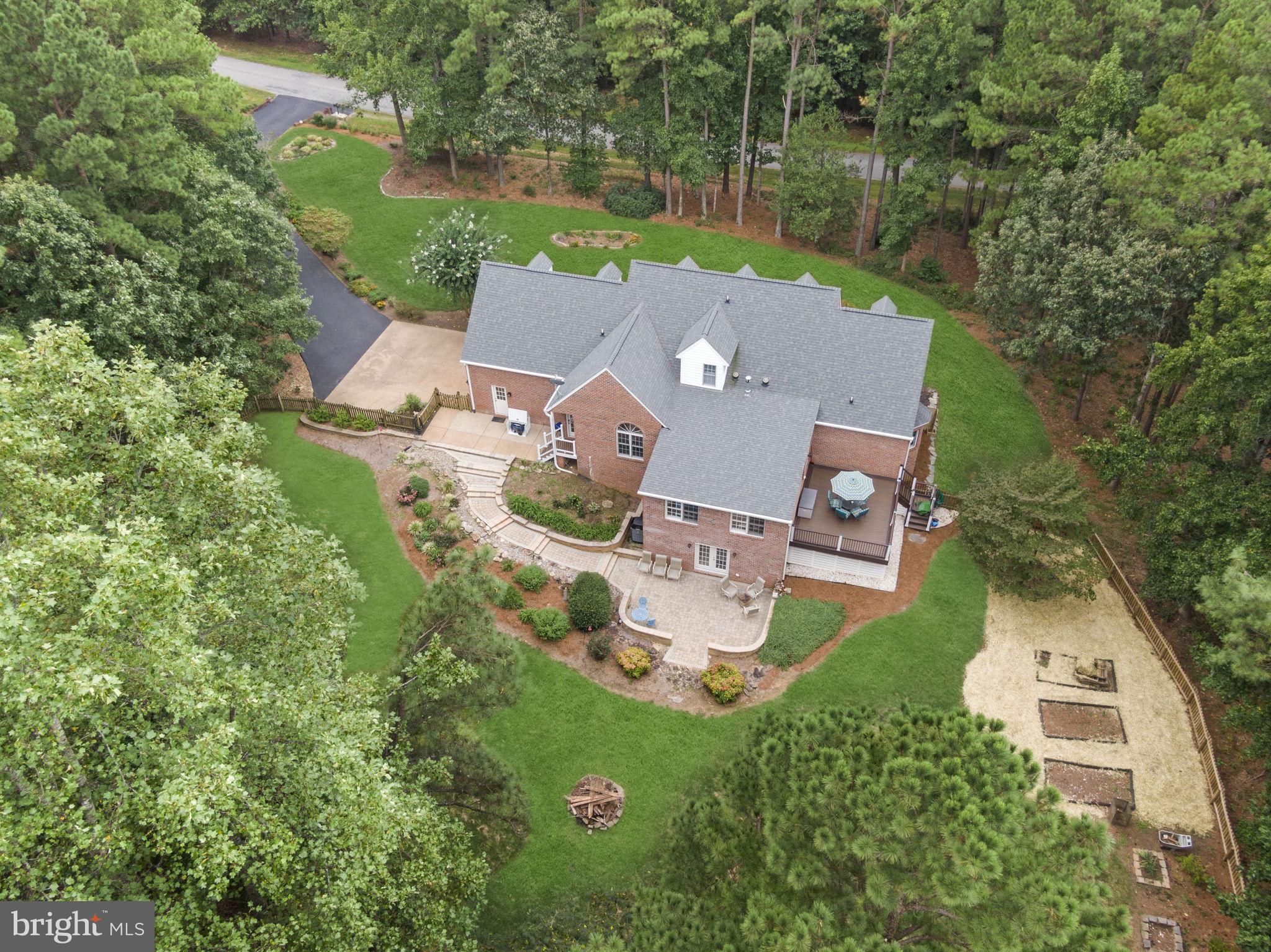 15130 Deep Spring Drive Montpelier, VA 23192 - Photo 12 of 66 an aerial view of a house with swimming pool outdoor seating and yard