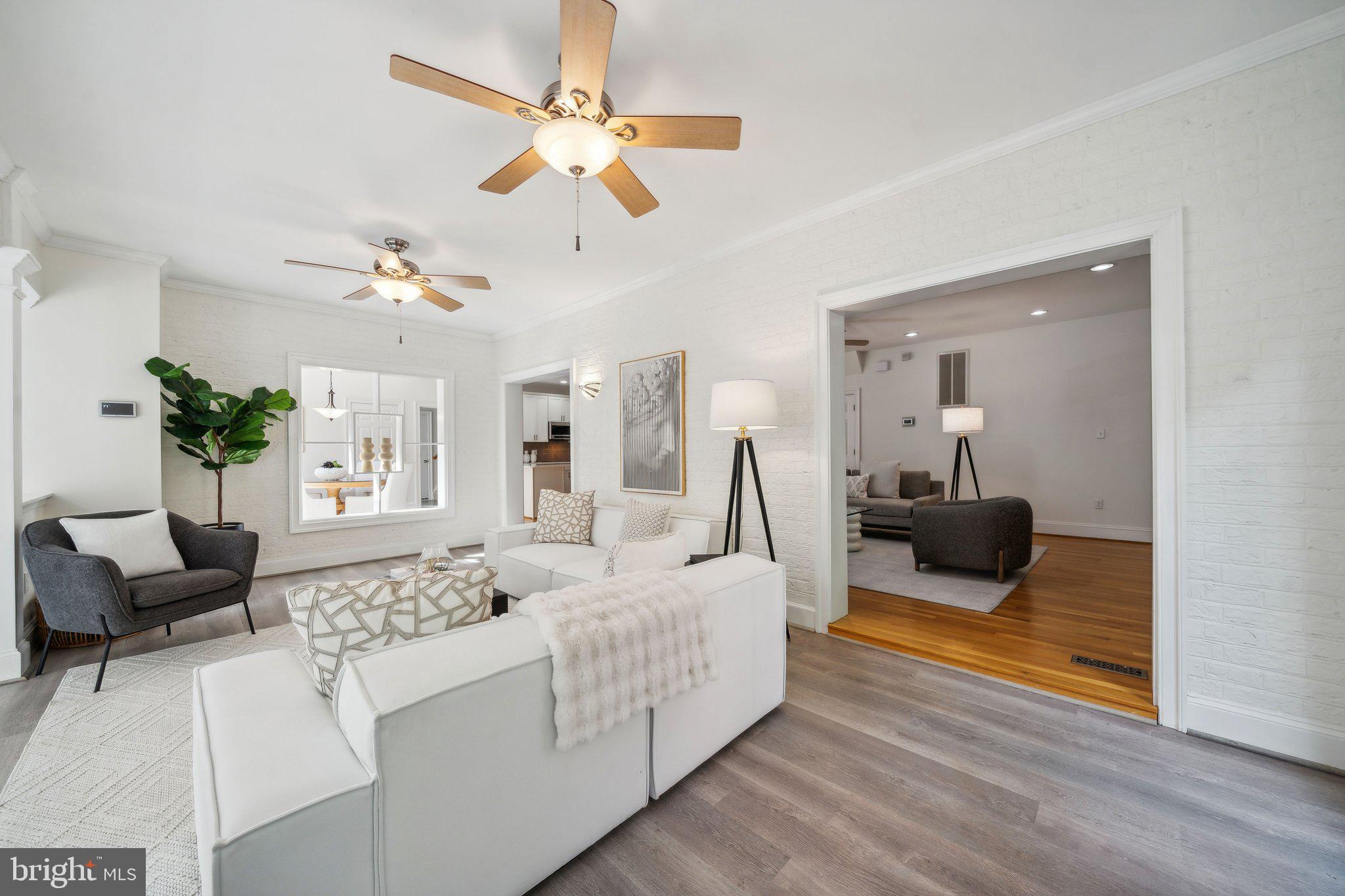 15130 Deep Spring Drive Montpelier, VA 23192 - Photo 29 of 66 a living room with furniture and a chandelier