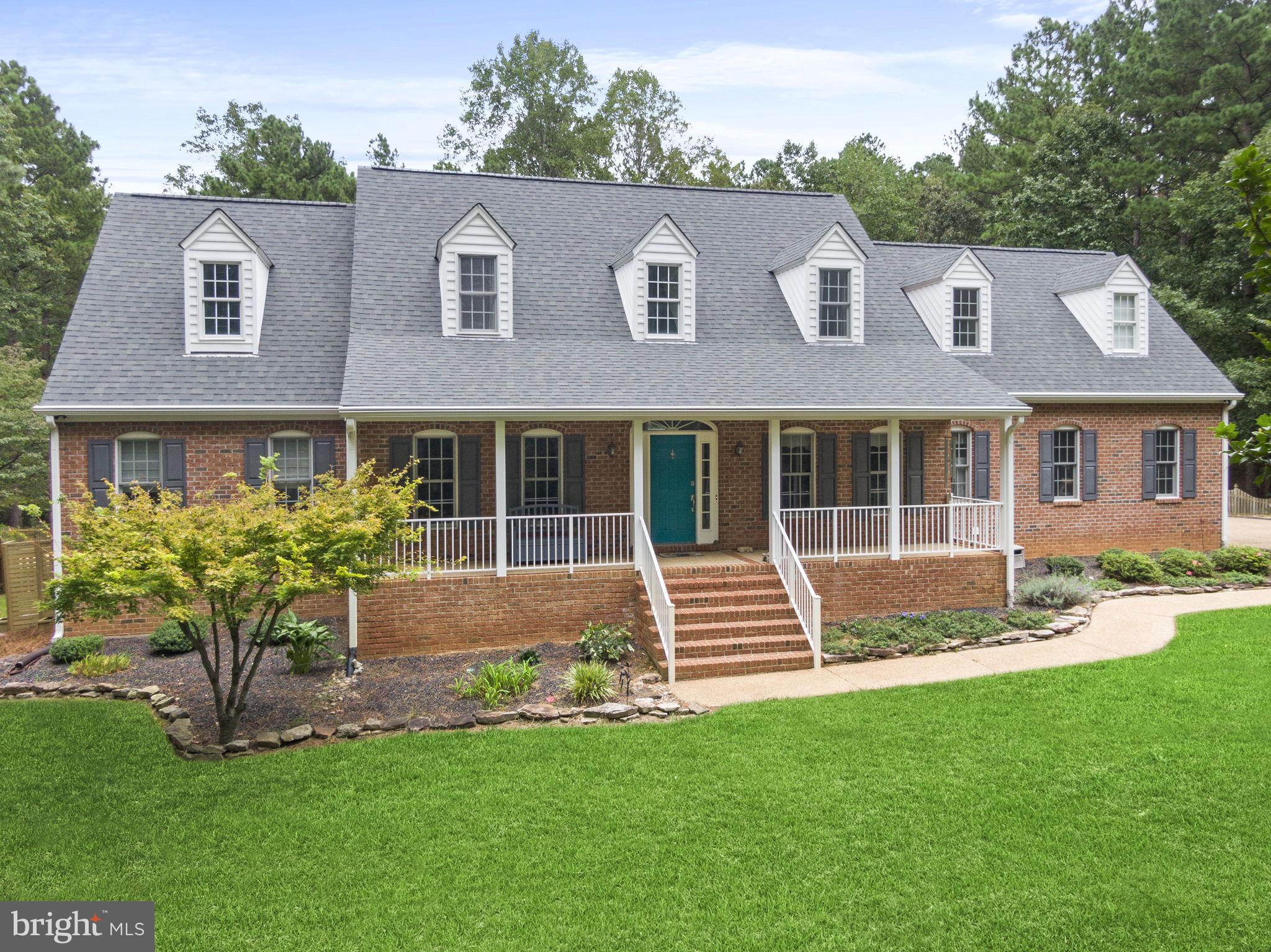 15130 Deep Spring Drive Montpelier, VA 23192 - Photo 3 of 66 a front view of a house with a yard