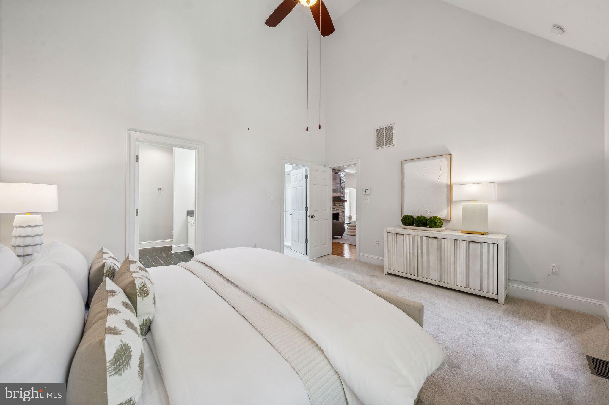 15130 Deep Spring Drive Montpelier, VA 23192 - Photo 31 of 66 a bedroom with a bed and a chandelier