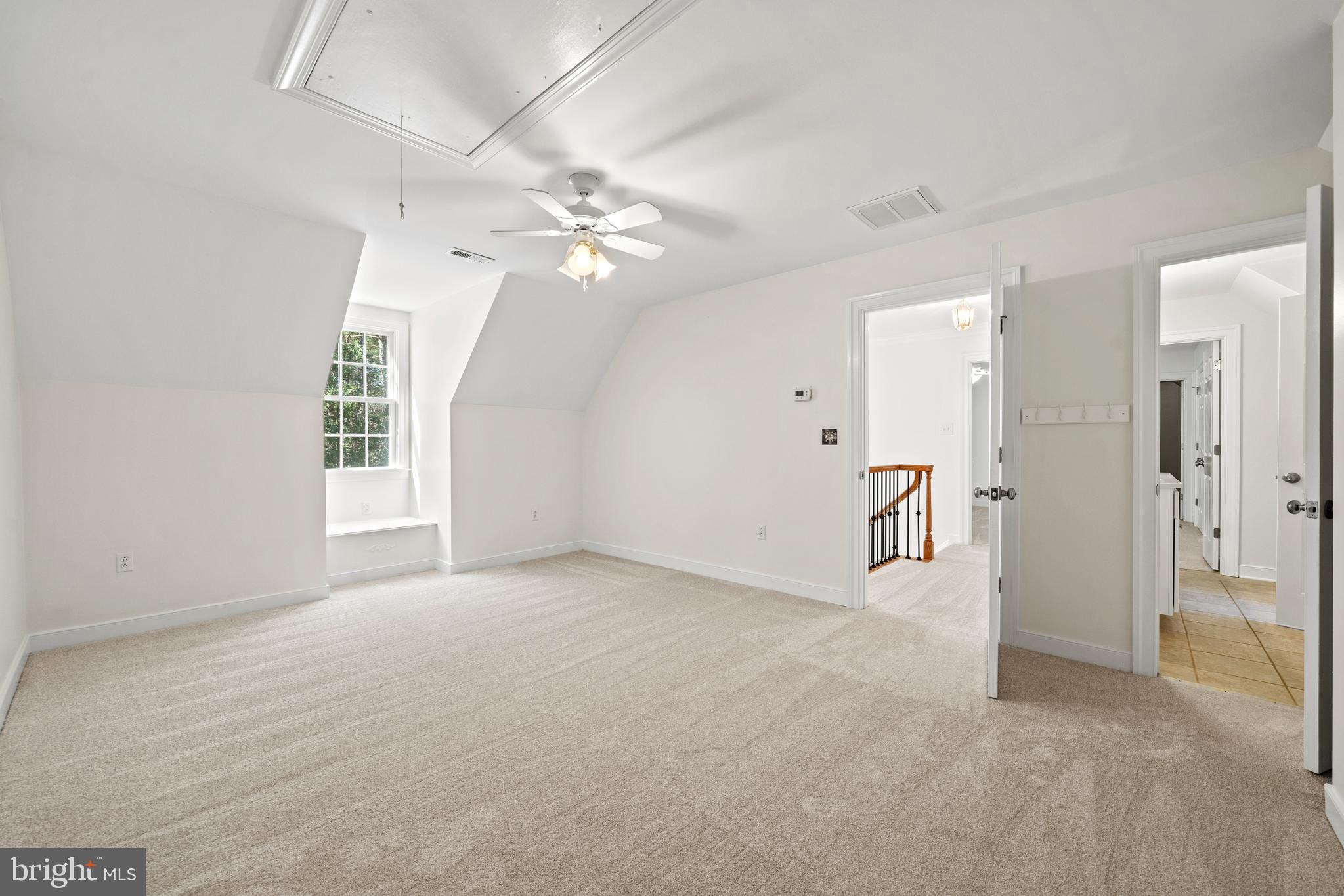 15130 Deep Spring Drive Montpelier, VA 23192 - Photo 39 of 66 en empty room with windows and ceiling fan
