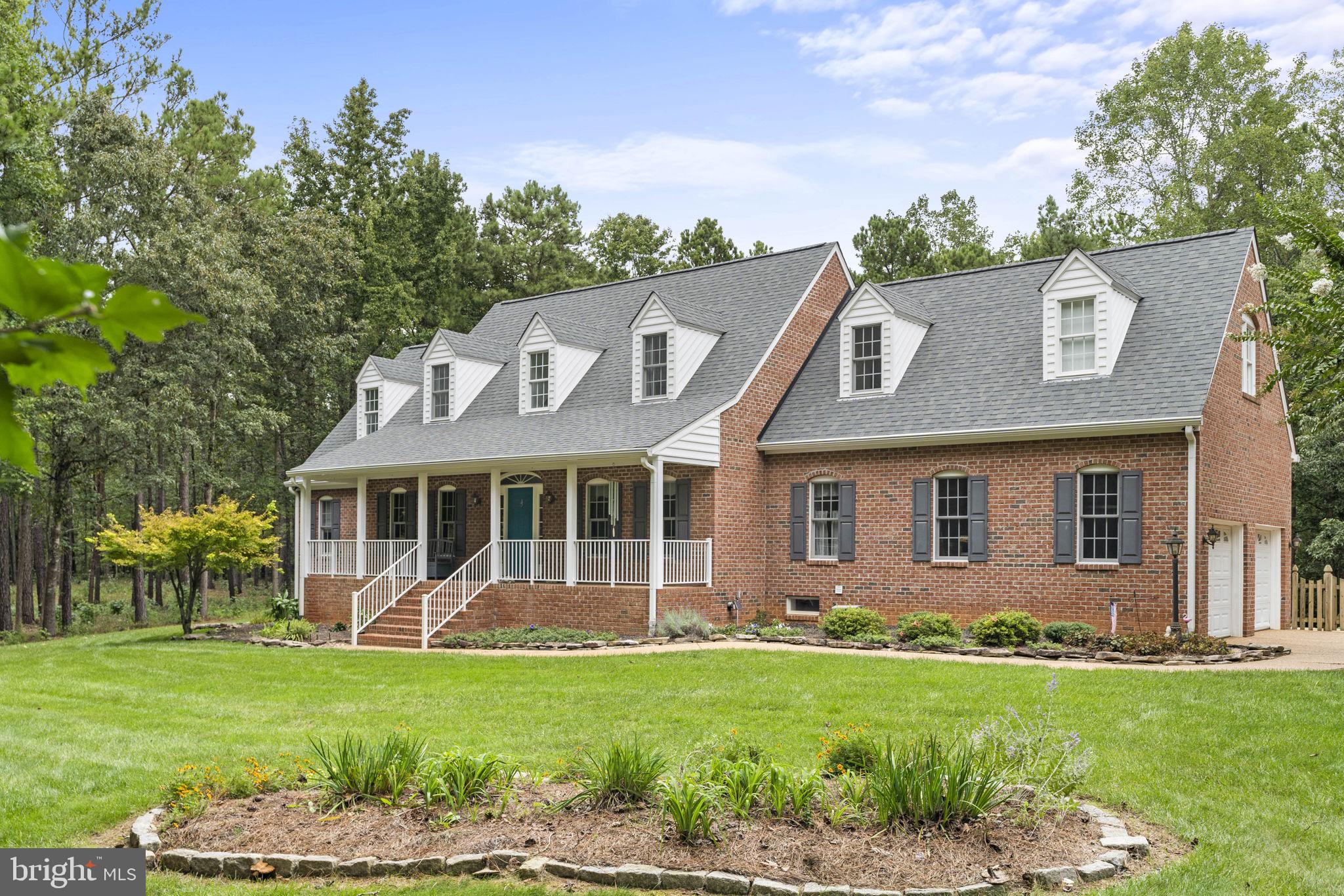 15130 Deep Spring Drive Montpelier, VA 23192 - Photo 4 of 66 front view of a house with a yard