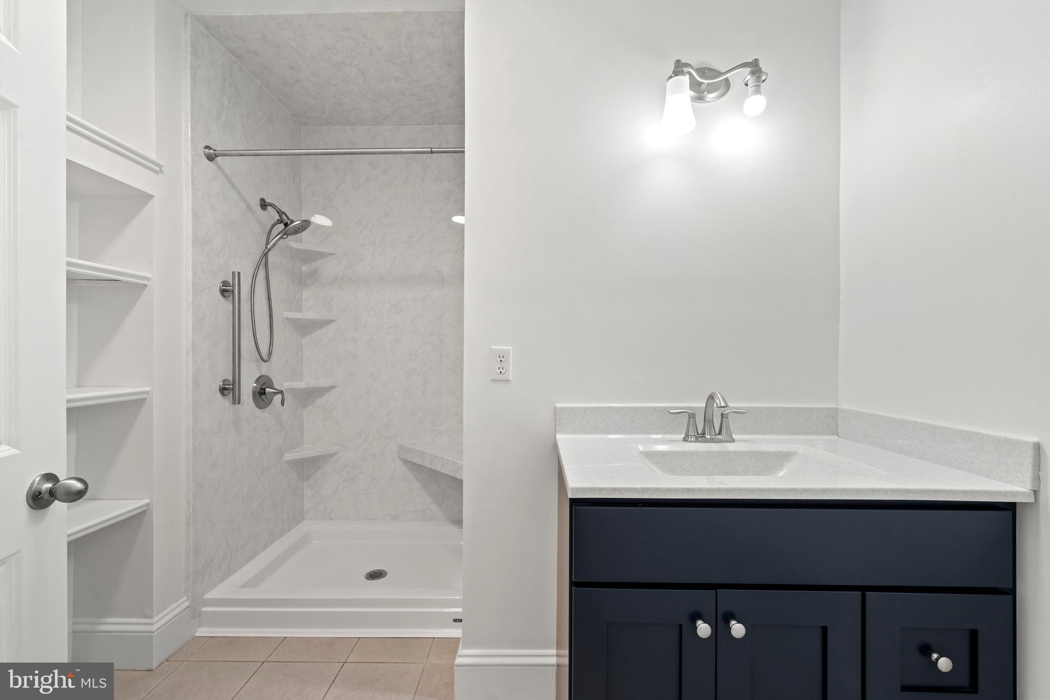15130 Deep Spring Drive Montpelier, VA 23192 - Photo 52 of 66 a bathroom with a sink and a mirror