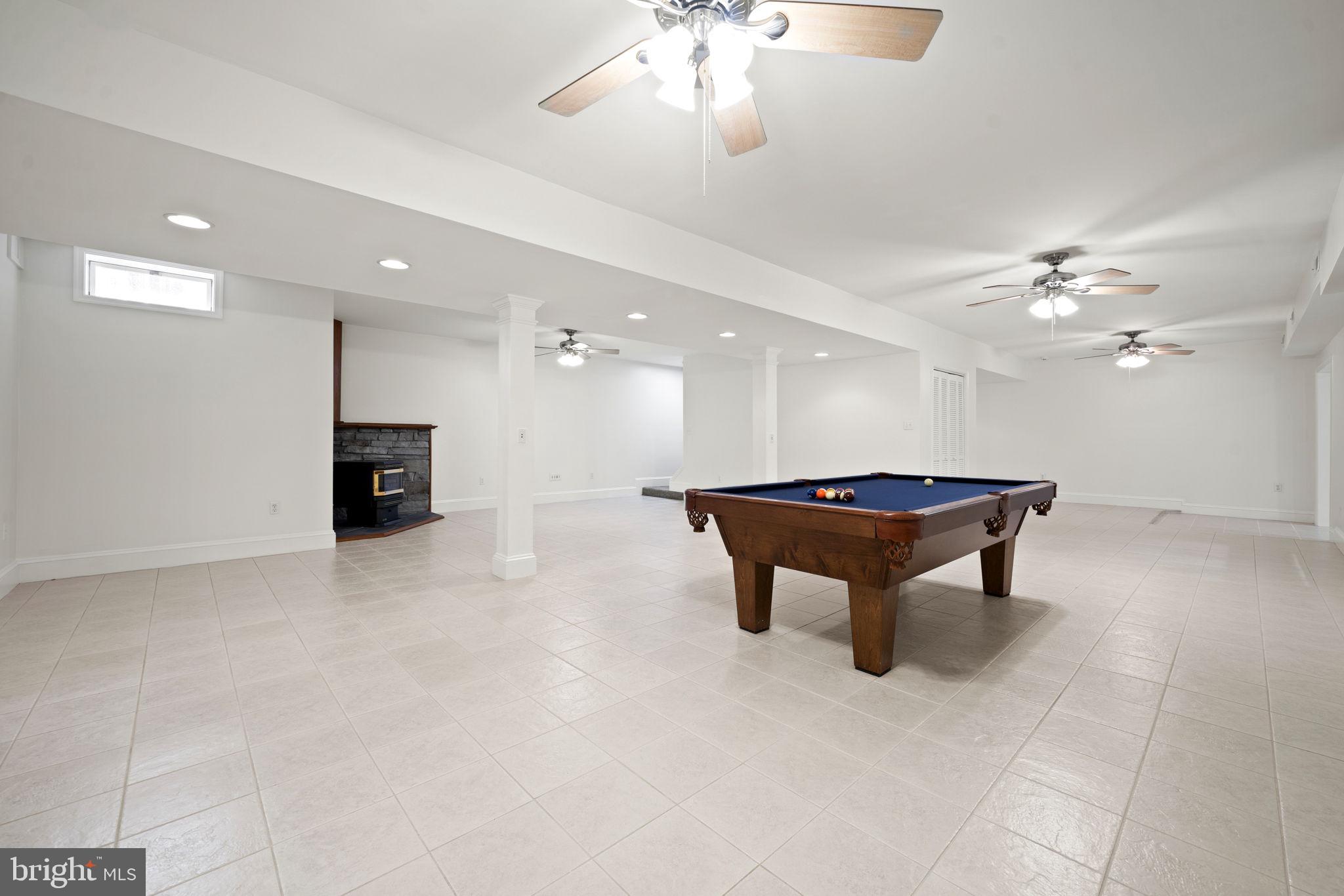 15130 Deep Spring Drive Montpelier, VA 23192 - Photo 53 of 66 a room with pool table and a chandelier