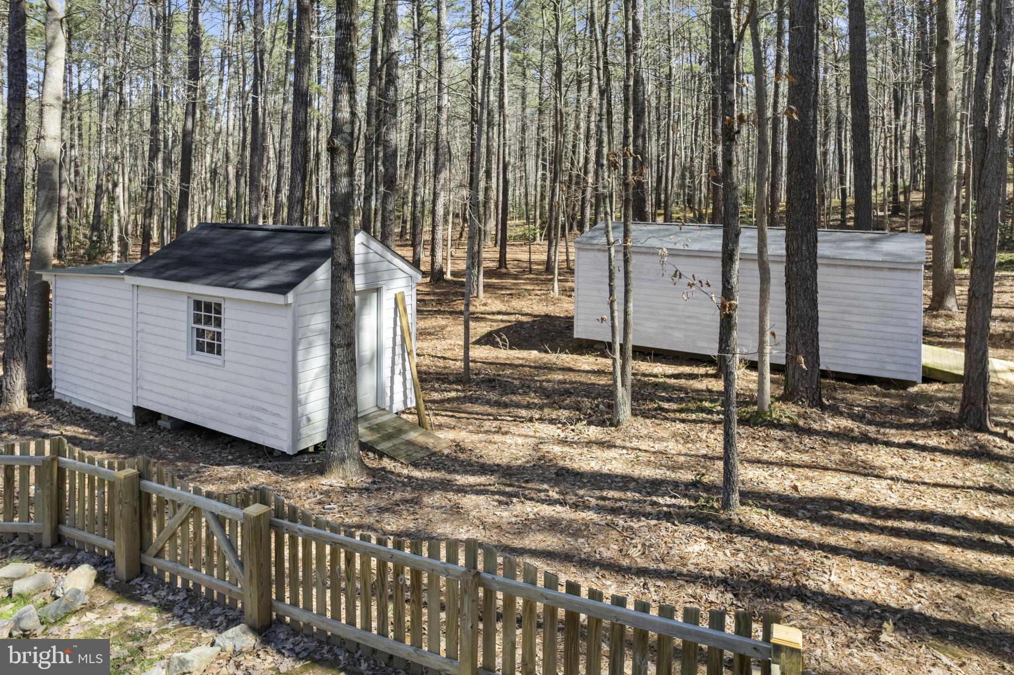 15130 Deep Spring Drive Montpelier, VA 23192 - Photo 56 of 66 a view of a house with a small yard and wooden fence