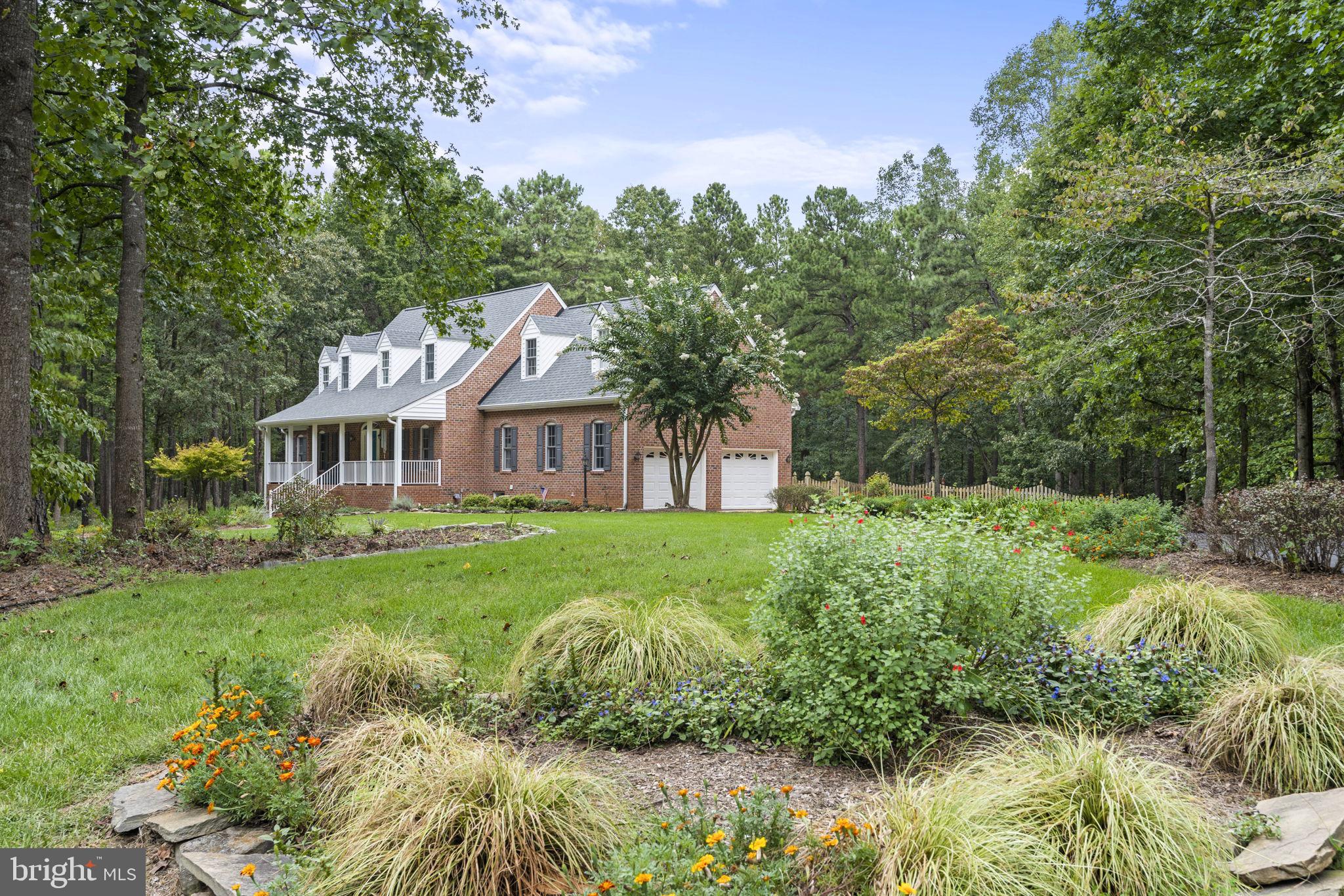 15130 Deep Spring Drive Montpelier, VA 23192 - Photo 66 of 66 a front view of a house with yard and green space