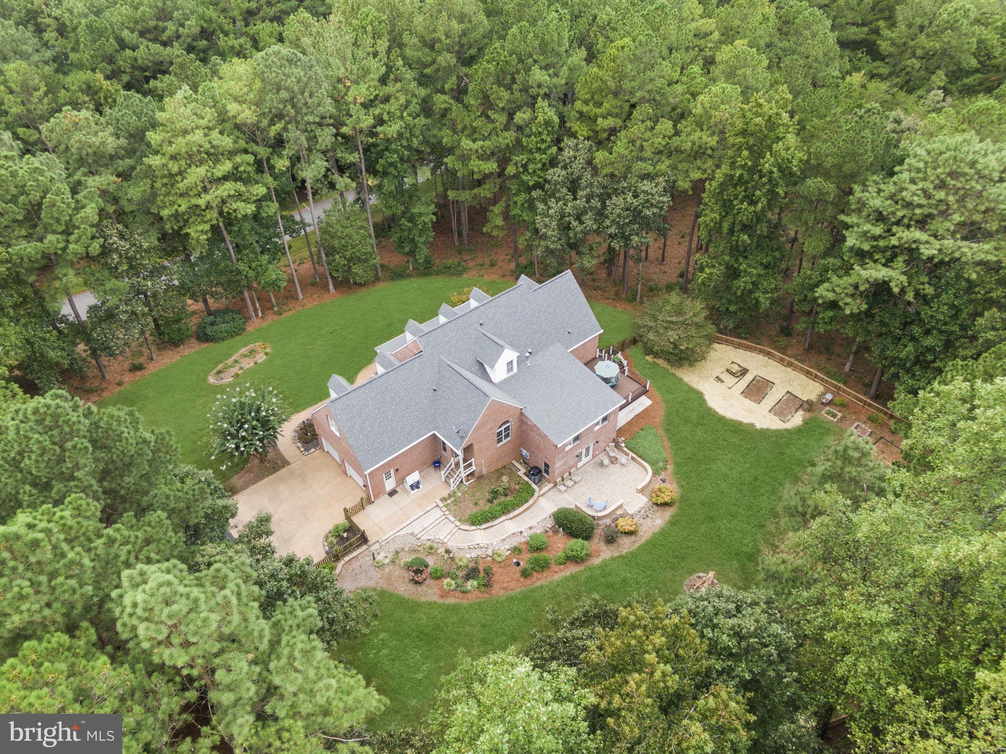 15130 Deep Spring Drive Montpelier, VA 23192 - Photo 10 of 66 an aerial view of a house with a garden and trees