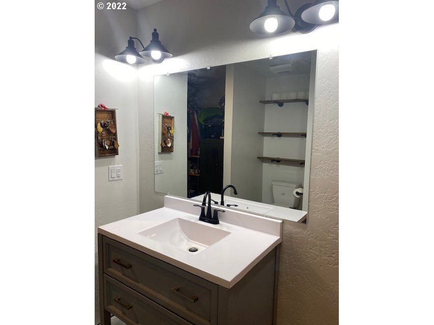173 West Bryan Street Union, OR 97883 - Photo 17 of 32 a bathroom with a sink and a mirror