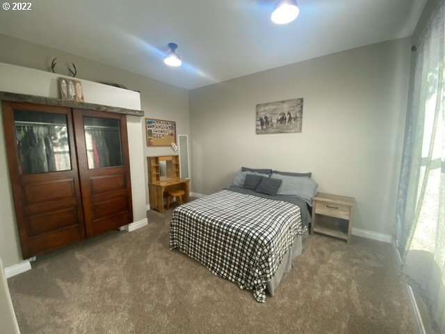 173 West Bryan Street Union, OR 97883 - Photo 18 of 32 a bedroom with a bed and a television