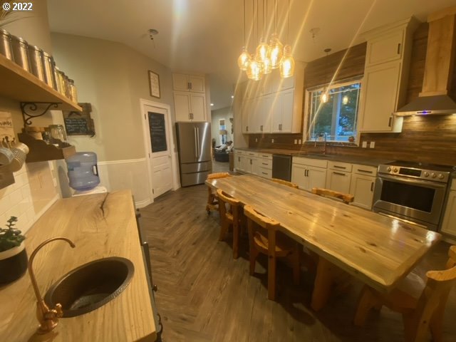 173 West Bryan Street Union, OR 97883 - Photo 6 of 32 a kitchen with stainless steel appliances granite countertop a sink counter space and a stove