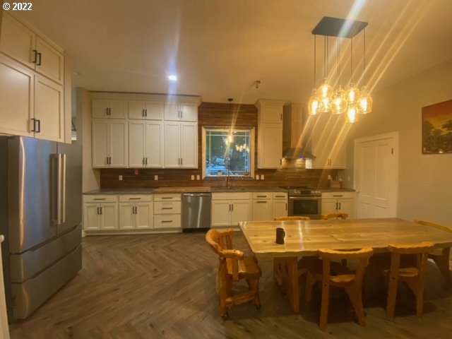 173 West Bryan Street Union, OR 97883 - Photo 7 of 32 a kitchen with kitchen island granite countertop a sink cabinets and stainless steel appliances