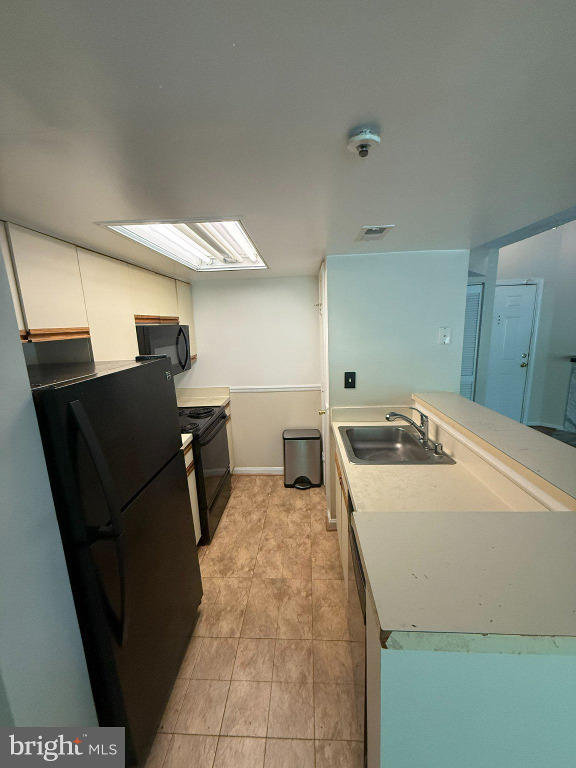10510 Beacon Ridge Drive, Unit 14202 Bowie, MD 20721 - Photo 12 of 17 Cozy kitchen with modern essentials.