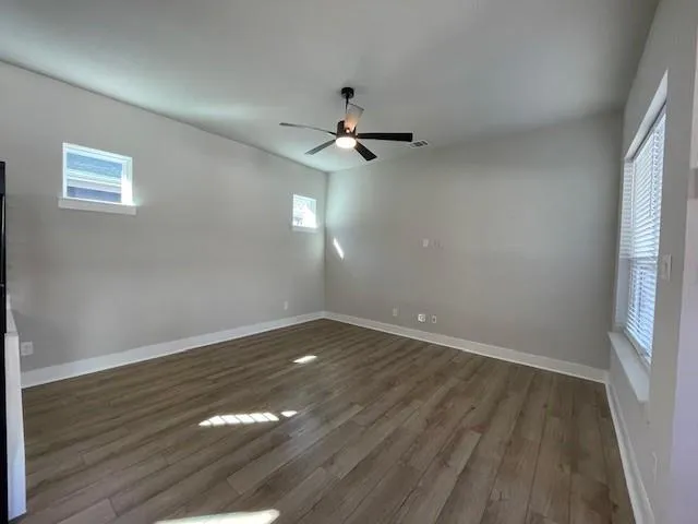 a view of a kitchen counter space and wooden floor
