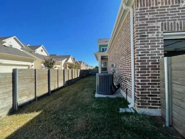 a bathroom with a glass shower door a sink and a mirror