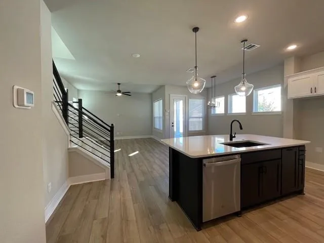 a view of front door of house with stairs