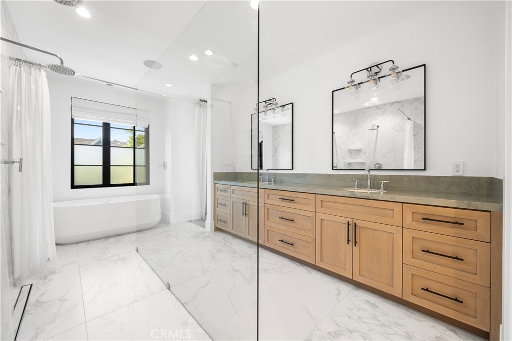 616 Acacia Avenue Corona del Mar, CA 92625 - Photo 10 of 20 a spacious bathroom with a granite countertop sink mirror and
