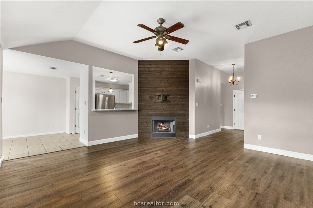 3709 Springfield Drive College Station, TX 77845 - Photo 5 of 23 an empty room with wooden floor and a ceiling fan