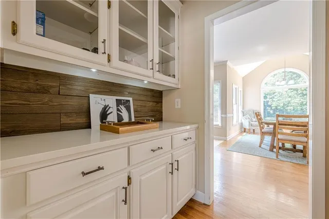 a living room with furniture and large windows