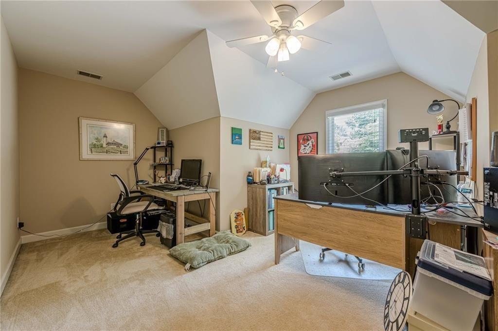 1765 Pinetree Pass Lane Southwest Lilburn, GA 30047 - Photo 21 of 44 a view of a livingroom with workspace and a window