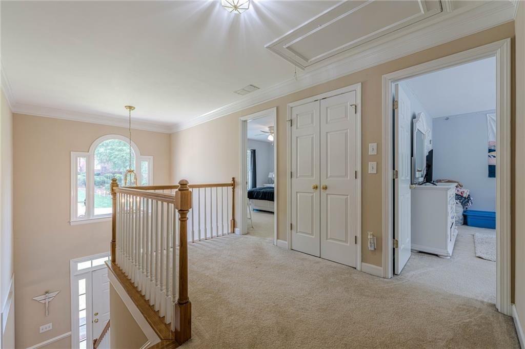 1765 Pinetree Pass Lane Southwest Lilburn, GA 30047 - Photo 34 of 44 a view of a hallway with windows and stairs