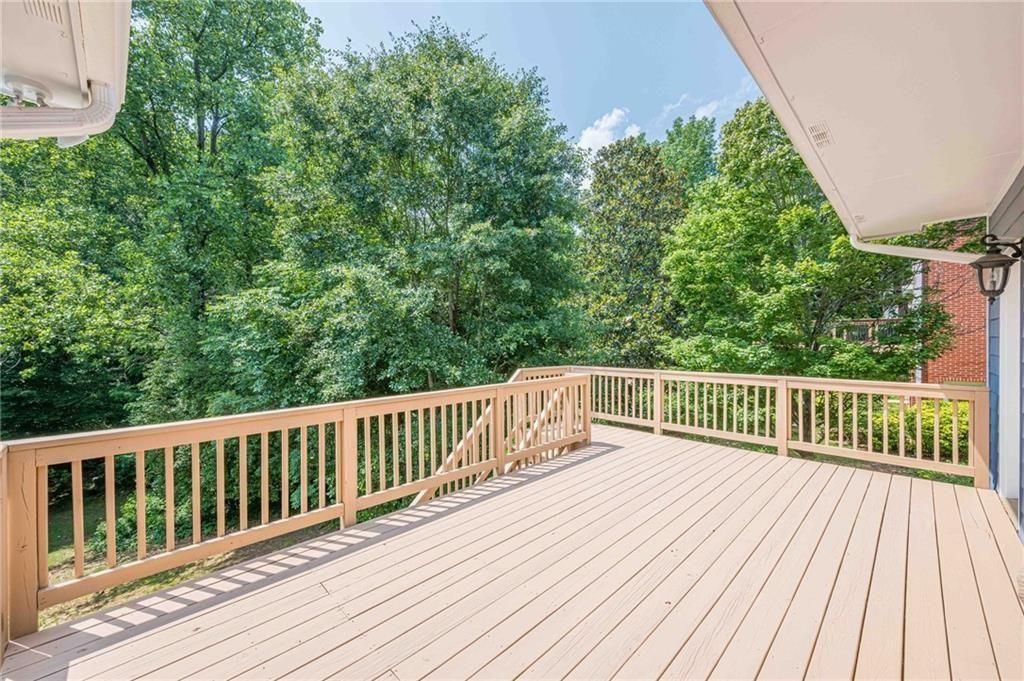 1765 Pinetree Pass Lane Southwest Lilburn, GA 30047 - Photo 36 of 44 a view of balcony with wooden floor and fence