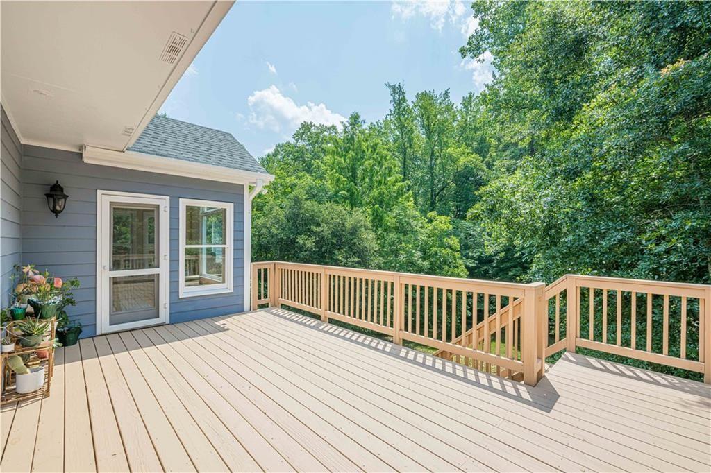 1765 Pinetree Pass Lane Southwest Lilburn, GA 30047 - Photo 38 of 44 a view of a wooden deck